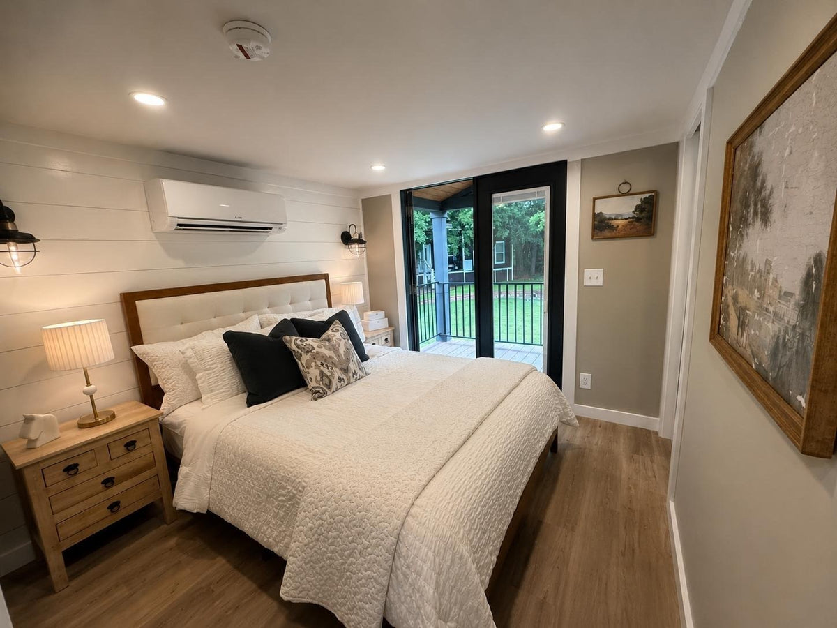 Honey Hollow main-level bedroom with a queen bed and mini-split air conditioning